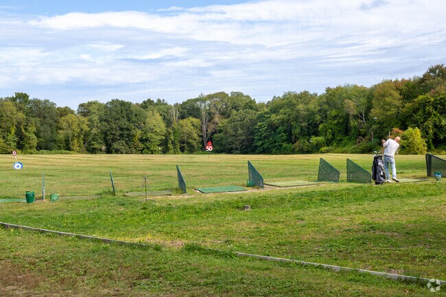 Golfers warm up at Colchester’s Chanticlair Public Golf Course and driving range.