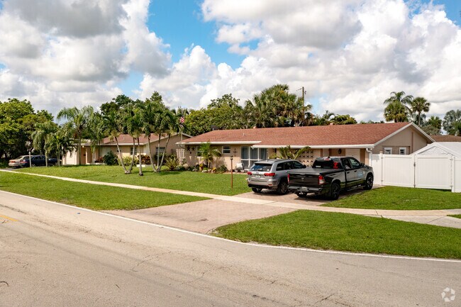 Street view of Simplistic Ranch Style Homes in Coconut Creek, FL.