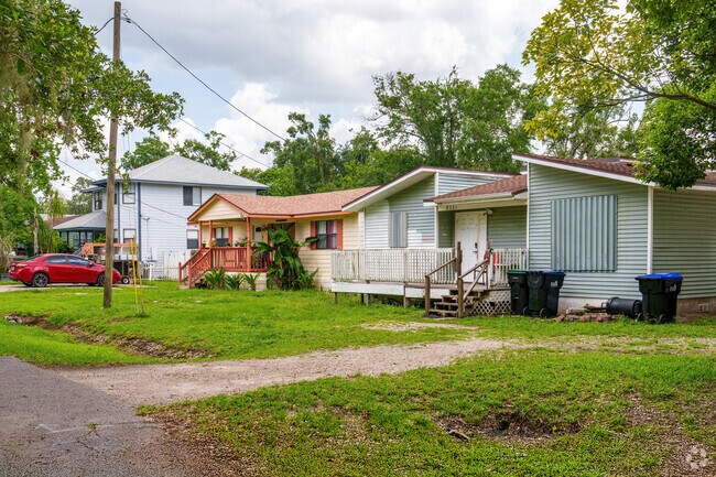 A row of homes in Taft features spacious front porches and mature trees.