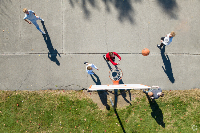 Teenagers often play basketball at Forest Park in West Noblesville for fun and exercise.