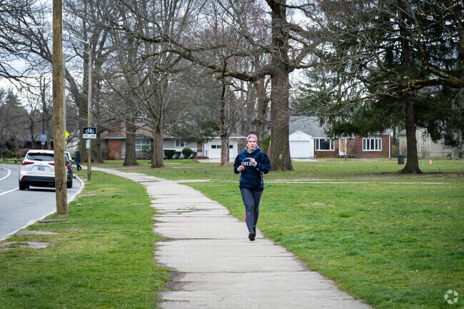 Indulge in a refreshing run along the vibrant Blackstone Blvd in Providence's Oak Hill.