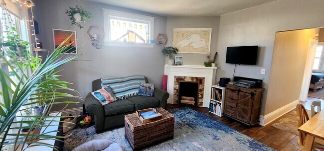 Living Room – Entry View with Decorative Fireplace & Built-In Mantel