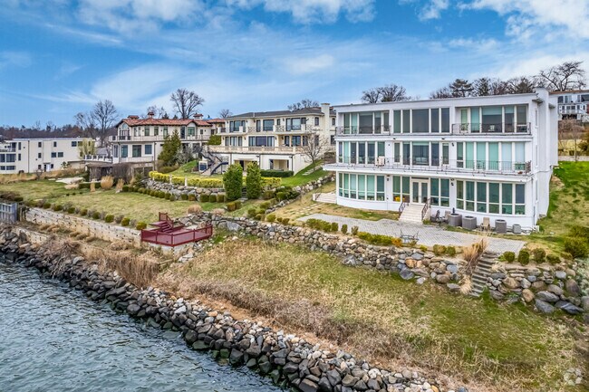 Here is a row of beautiful waterfront homes in Saddle Rock.