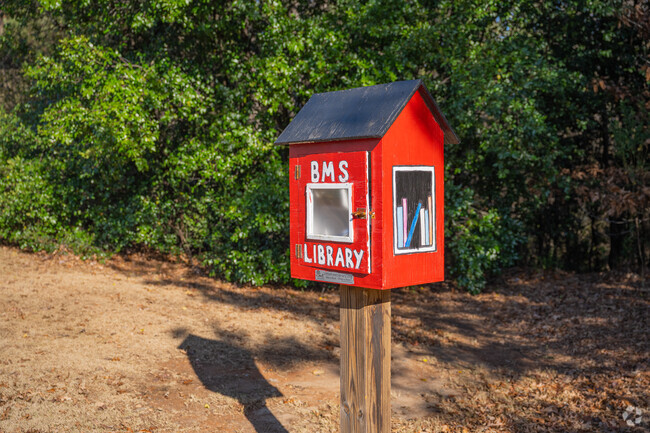 Enjoy a book from the free little library at Berkmar Middle School.