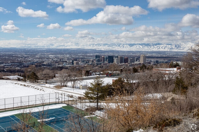 Winter shadows stretch across The Avenues beneath avalanche-prone mountain slopes.