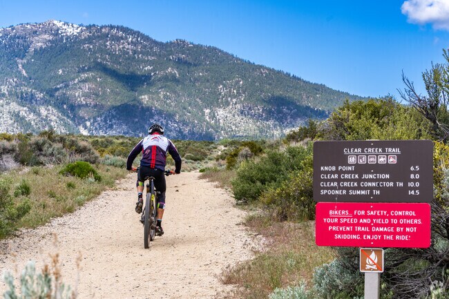 A dirt bike rider speeds along Clear Creek Trail near Johnson Lane.
