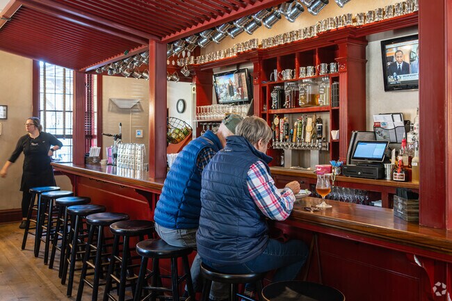 Locals gather at Cantwell’s Tavern for hearty meals and craft drinks in a rustic setting.