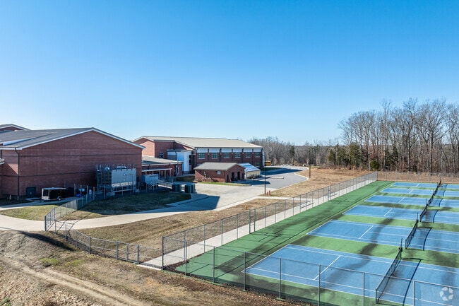 Modern tennis courts are featured at Oak Grove High School.