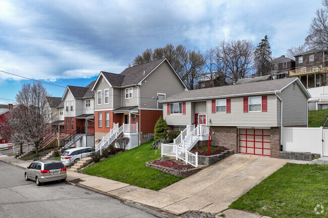 Ranch and pitched roof houses with garages are located throughout Garfield.