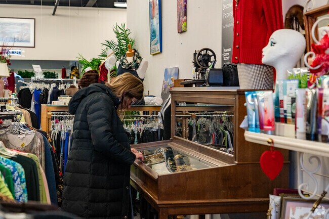 A customer browses the jewelry at the Discovery Shop in Wallhaven.