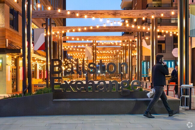 Experience the captivating glow of the Ballston Exchange sign illuminating in the evenings.