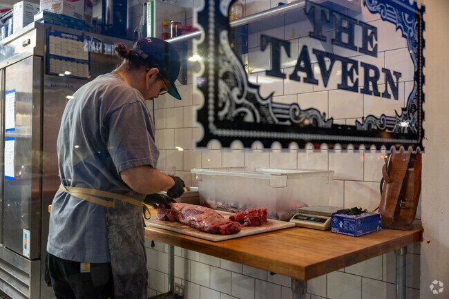 The butcher at the Tavern proudly trims their highest cuts of meat in Downtown Tulsa.