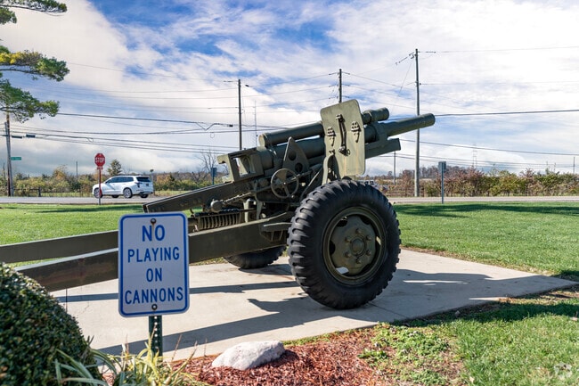 A historic green cannon stands in Hanover Township Metro Park.