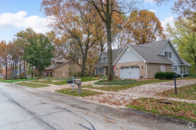 Rows of homes sit on large lots under mature trees in high end neighborhoods in Valparaiso.