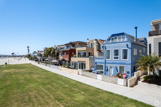 Colorful homes with patios line the boardwalks, offering vibrant views along Mission Bay.