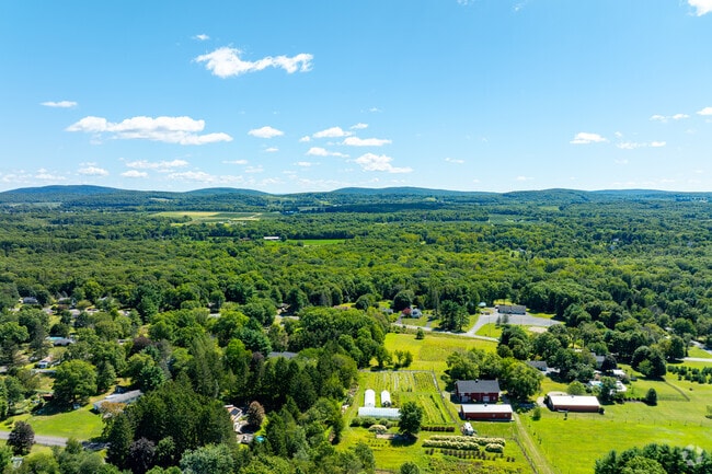 Wooded neighborhoods sit between Main Street and the ridge.