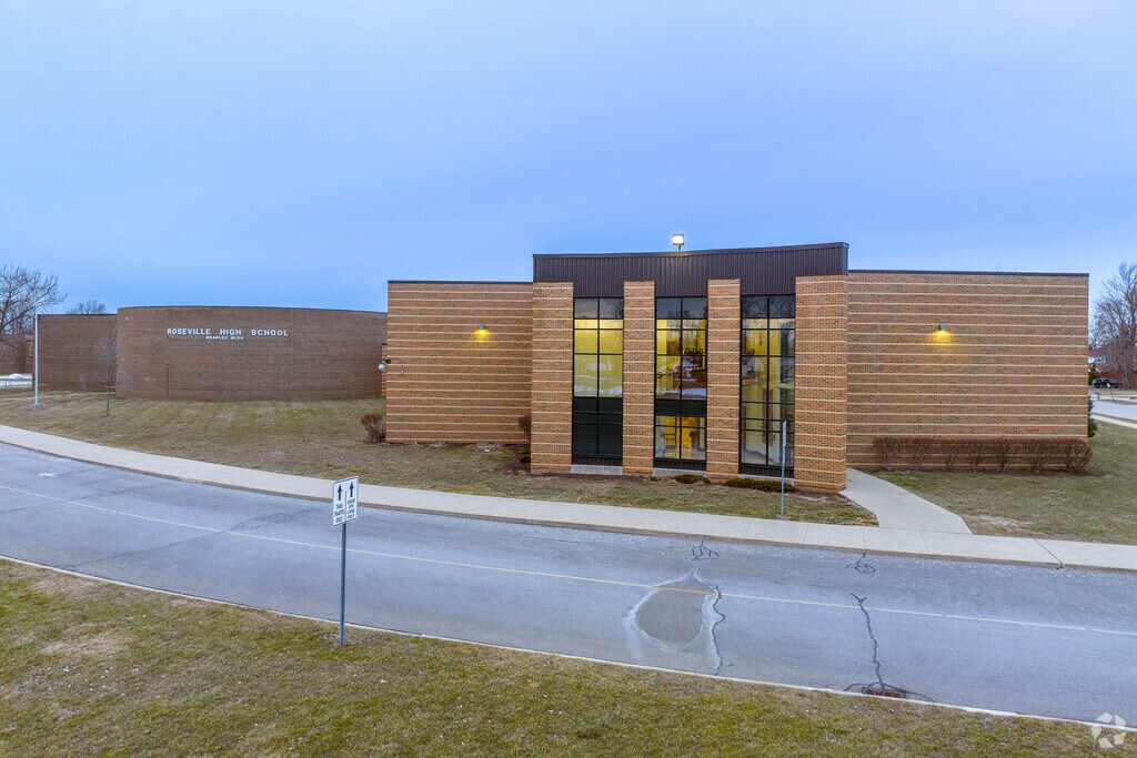 The Brablec Building is aglow at night at Achievement High School.