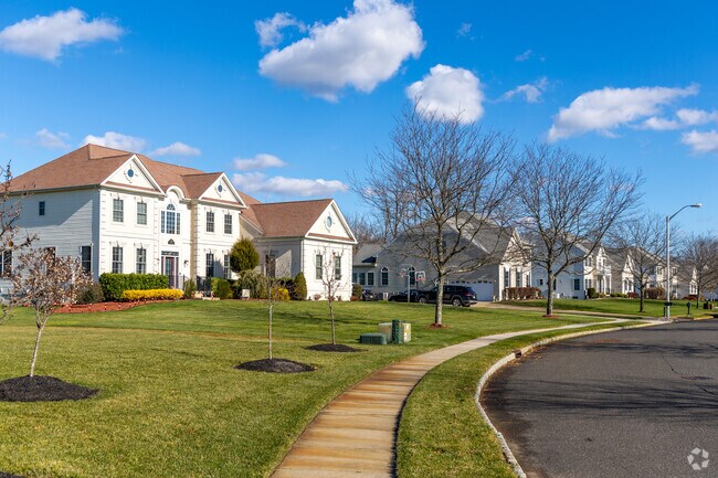 Winding streets with large colonial style homes are located in Adelphia.
