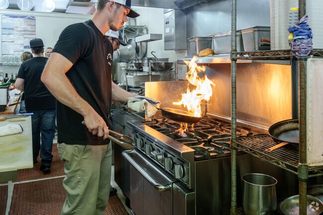 Chef Chase Nelson cooks jambalaya for the hungry lunch crowd at Po Boys in Milton.