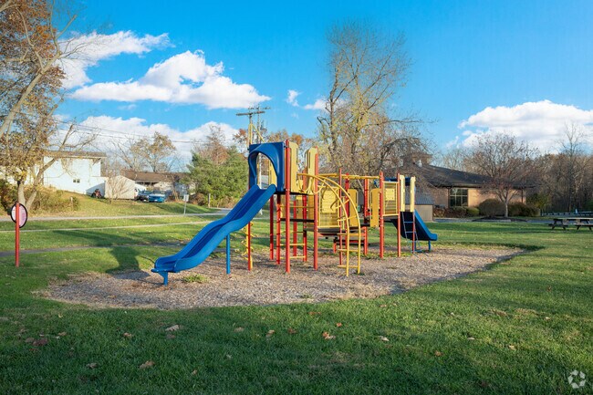 Sardinia features a park conveniently located just outside the local library.
