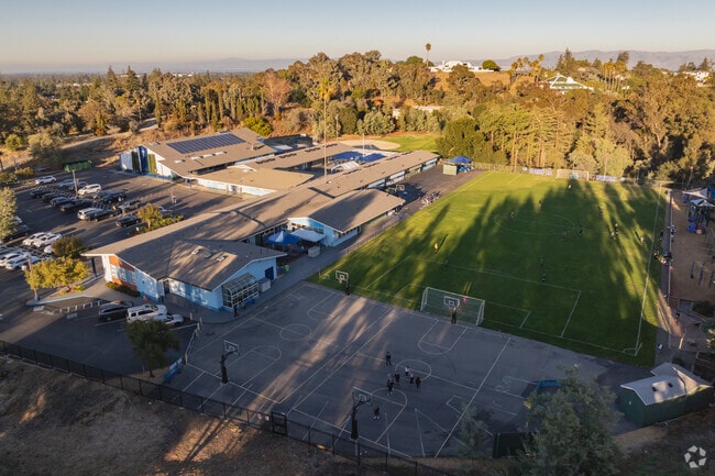 St. Nicholas Catholic School offers a large black top and lawn for students to play.