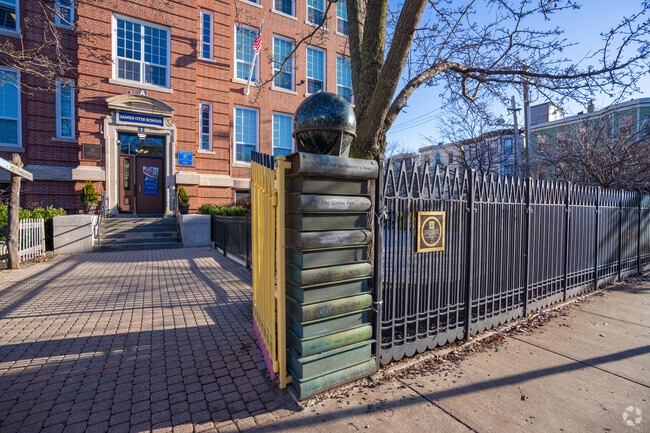 You'll see a stack of books outside James Otis Elementary School in East Boston.