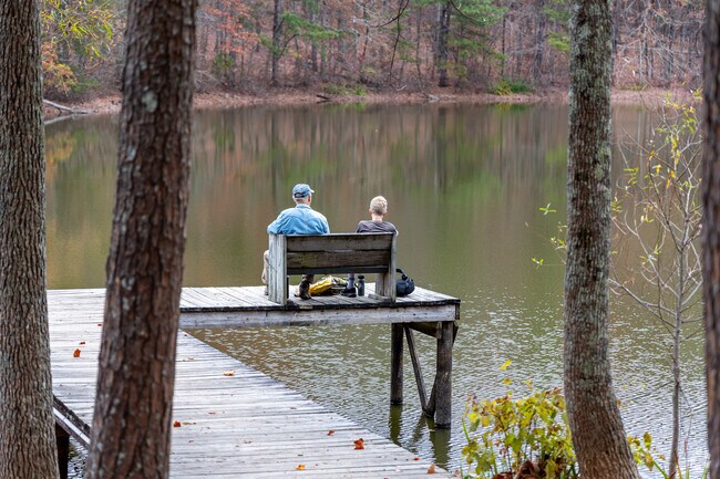 Enjoy the serenity of Madison County Nature Trail and take a seat next to the lake.