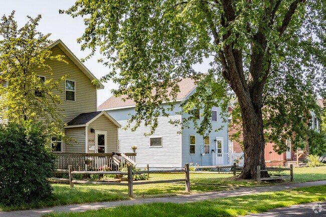 Old trees and rustic fences line this East End residential street in Superior Wisconsin.