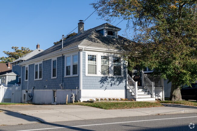 Bay-inspired blue exteriors appear on homes in The Alphabets.