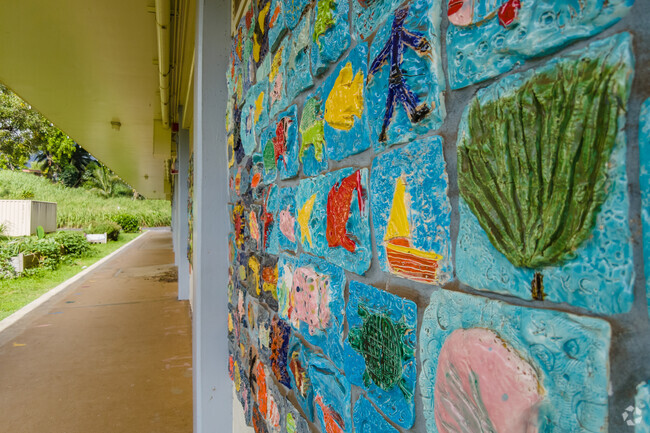 Experience the serene beauty and vibrant art at Puohala Elementary's manicured campus.