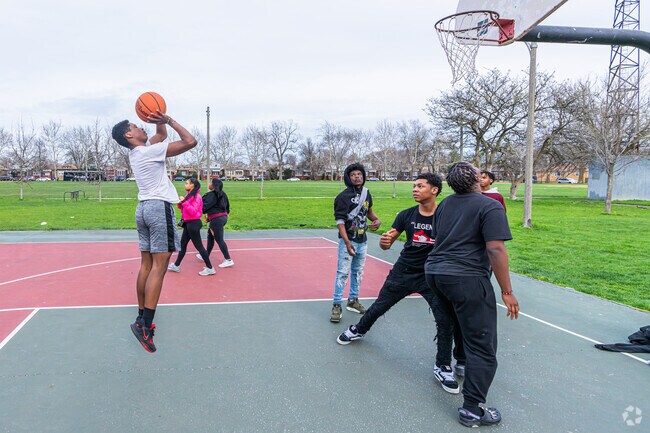 Kids enjoy the basketball court at Brainerd Park in Brainerd.