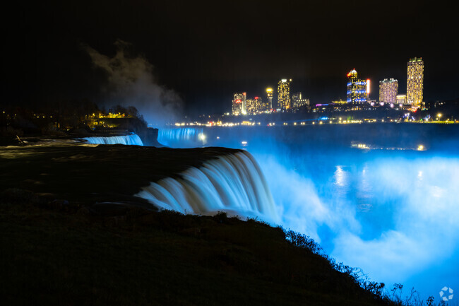 Enjoy the beautifully lit Niagara Falls at night.
