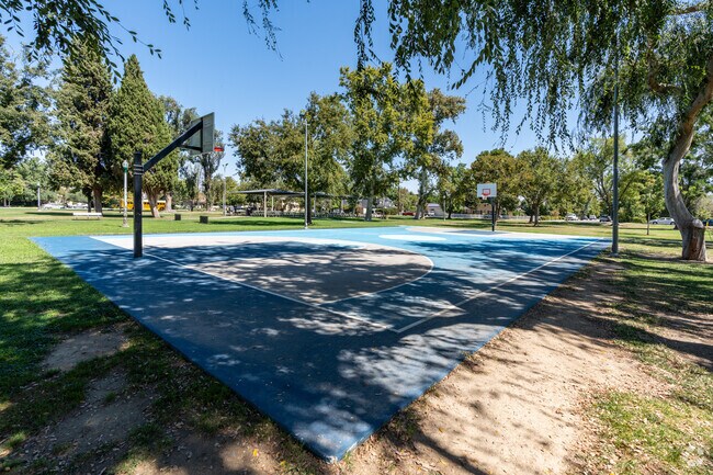 Play some basketball shaded by trees at Jastro Park in Downtown Bakersfield.