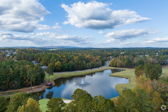 Golfers enjoy an 18-hole course at BridgeMill Athletic Club in Sutallee.