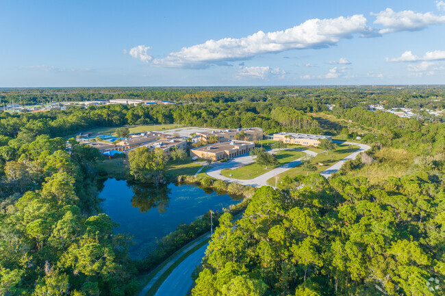 Davis Elementary School is next to a pond.