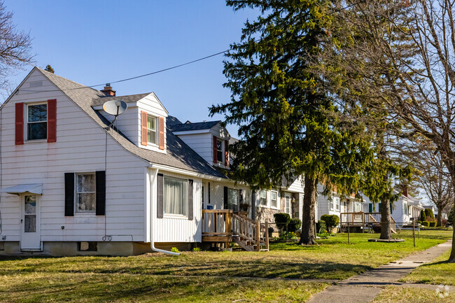 Cozy bungalow homes with compact lots and attached garages line the streets of Chevrolet.