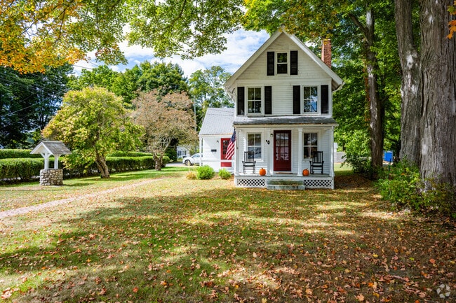 Three-story antique colonial homes full of windows are available for purchase in Old Lyme.
