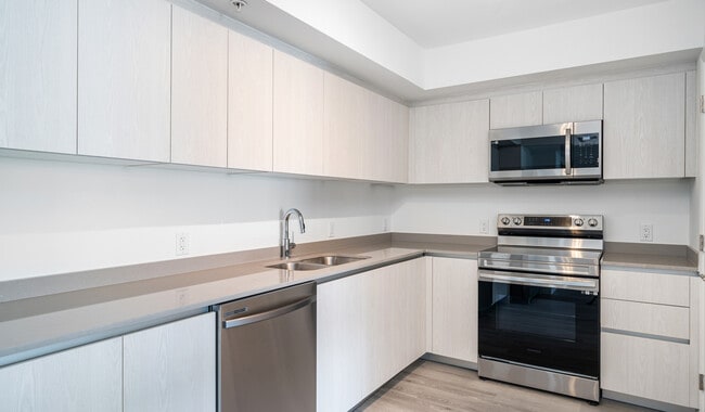 Your new home features spacious kitchens with brand-new stainless steel appliances.