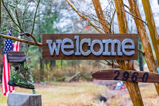 A Hampton Sted-Mountain Brook home features a welcoming sign for visitors.