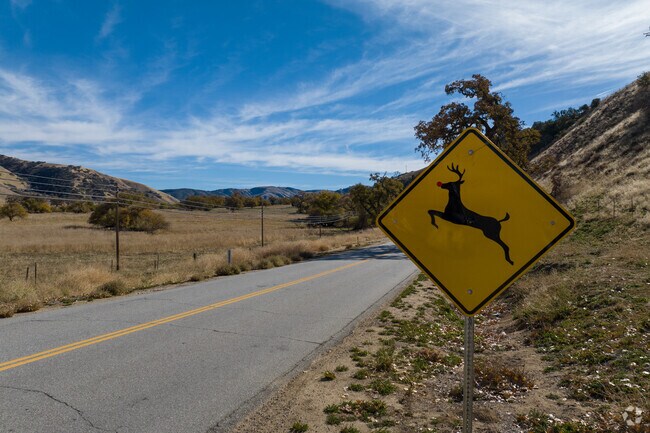 Deer crossing sign alerting drivers along the road in Lebec.