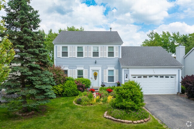 Colonial style homes with attached garages can be found in Cambridge.
