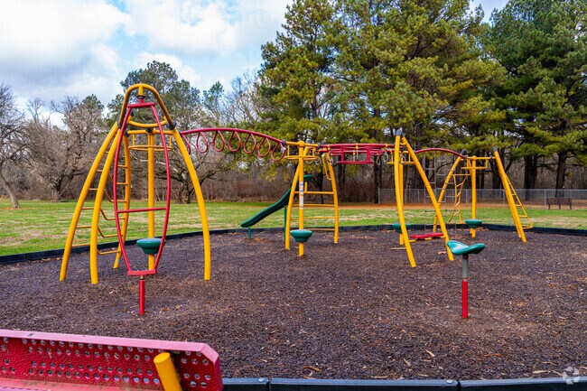 Tire out the tykes on the playground at East Meadow Park.