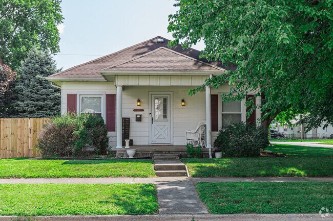 A bungalow in Fairlawn showcases a shaded front porch, perfect for people watching.
