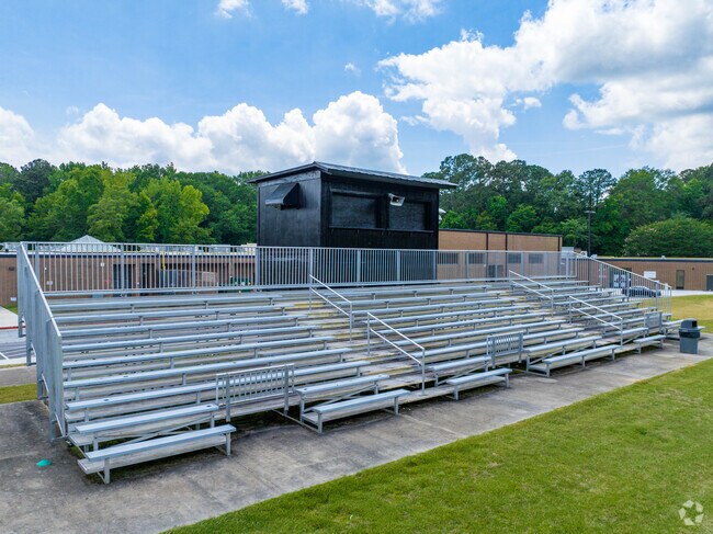 Sit on the bleachers and watch a football game at J.C. Booth Middle School.
