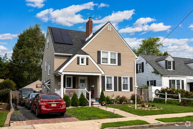 This two-story single home has a detached garage and solar panels in the Glendale neighborhood.
