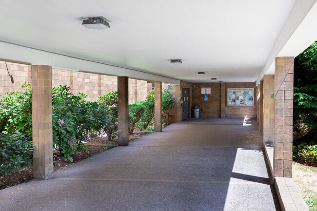 Covered main entrance of the Naya Early College Academy.
