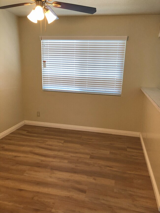 Separate Dining area, with ventian blinds and new flooring.