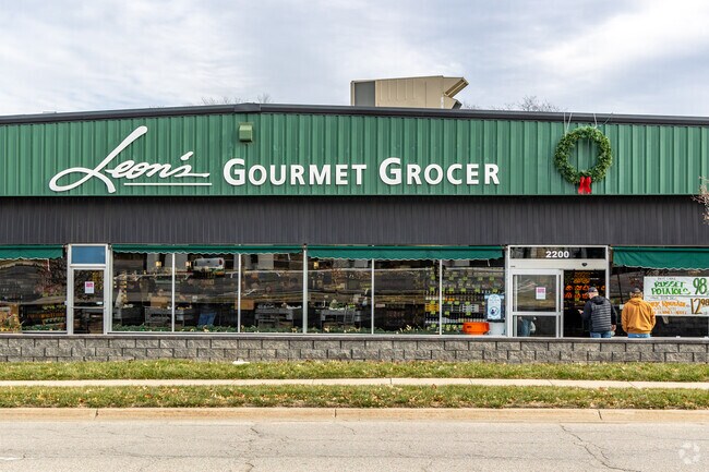 Neighbors shop for fresh goods at Leon's Gourmet Grocer near Antelope Park.