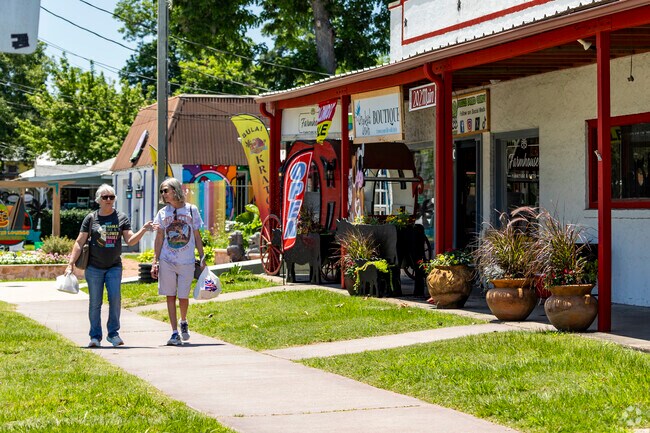 Two friends enjoy an afternoon out, shopping the local business of Old Town Spring.