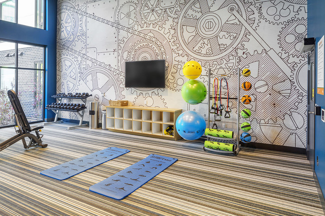 24-hour fitness center with yoga mats